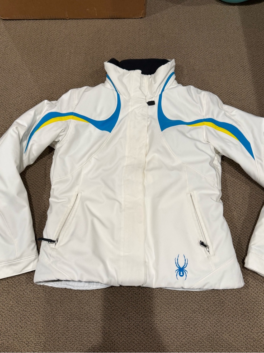 Spyder White Ski Jacket with Blue and Yellow Accents